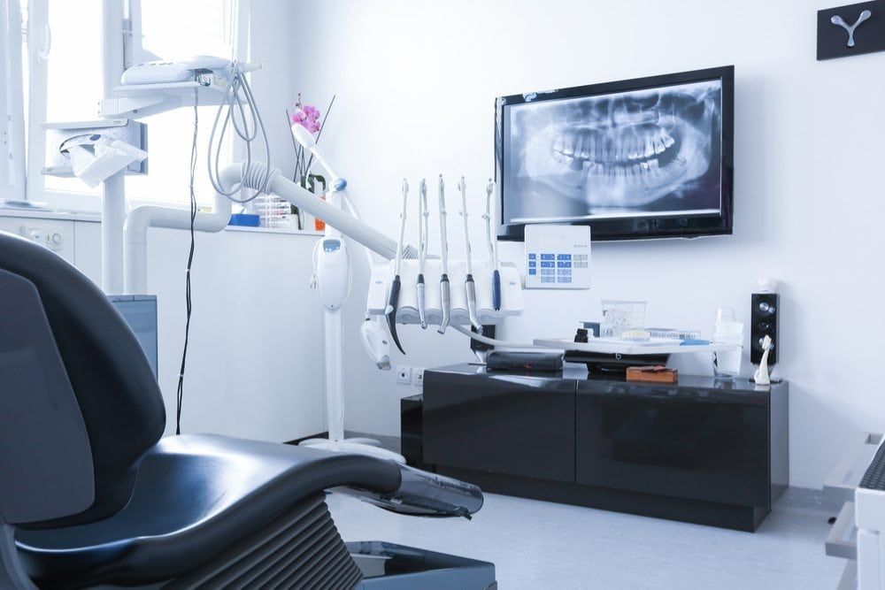 Modern Dental work station showing dental x rays, and equipment